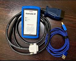 Garmin device with cables on a wooden surface